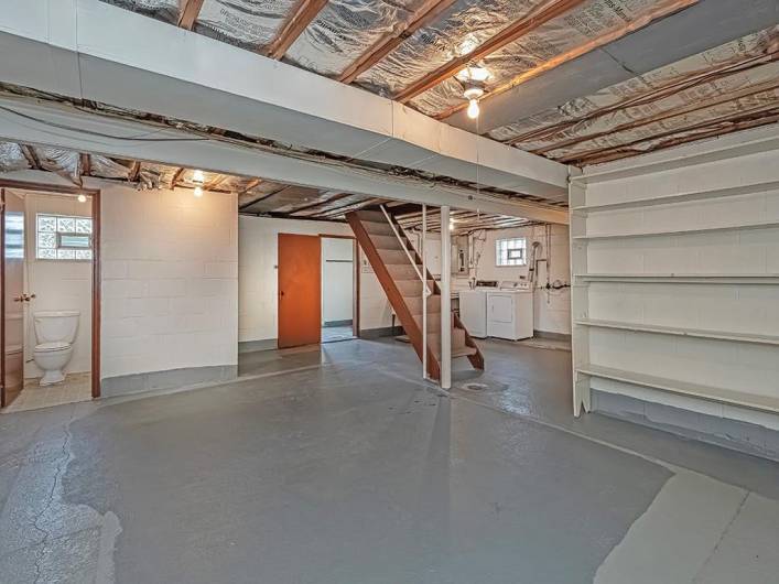 This (approx.) 25x27 basement has endless possibilities, lots of storage and a full bathroom with nice size (approx.) 3x5 shower. The wood door to the right is where the mud room is located.