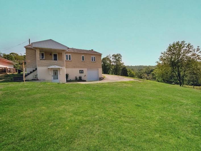 Well-cared for home, look another covered porch for relaxing on! Great yard for activities, pets or maybe a pool?