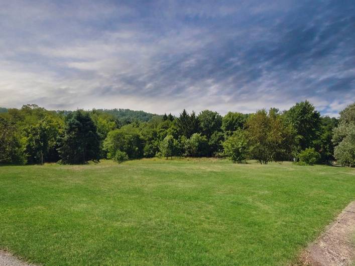 Wow Look at this yard! Endless possibilities! Do you like gardening? flowers/vegetables? Built in pool? Pets, outdoor activites or just green space? You decide!