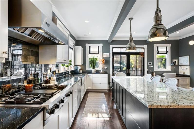 Plenty of island storage with granite counter tops.