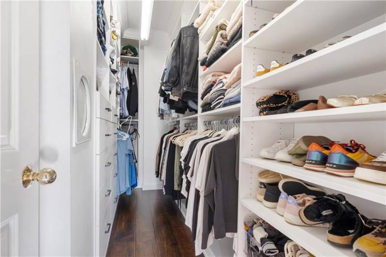 Primary bedroom closets with newly installed California Closet.