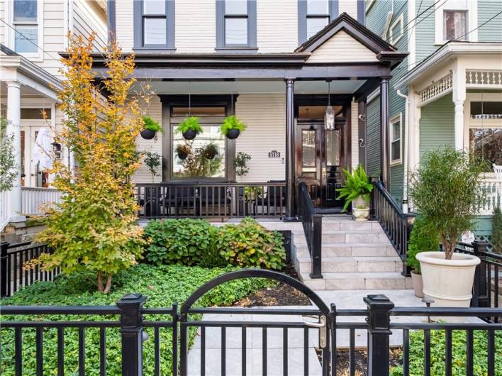 Tile walkway that leads you to tiled front porch.