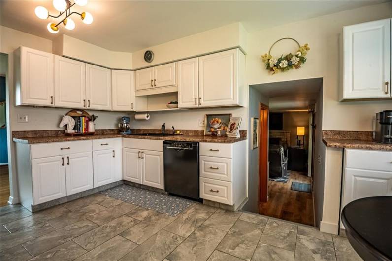 Kitchen, entry to Half Bath and Family Room