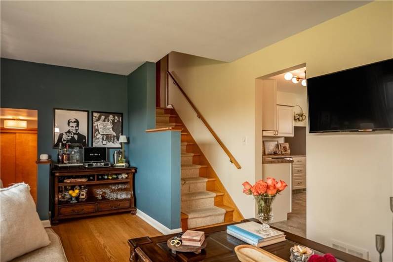 Living Room, gleaming hardwoods and stairs to the Bedroom Suite area