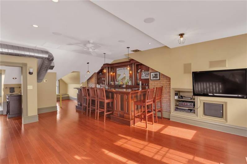 Alas! Nurture your inner Jerry Thomas with this custom built cherry wood bar on the third floor!