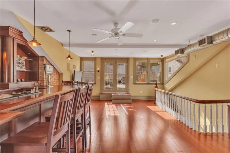 Patio doors take you to the first level of the rooftop deck.