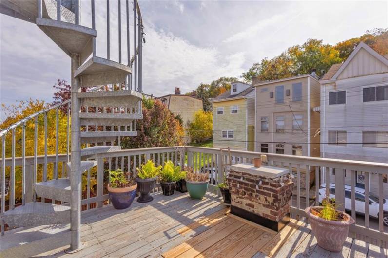 Tiered rooftop deck accessed from third floor.