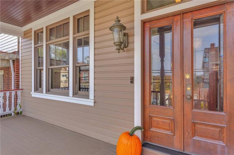 Solid double door entry with ceramic tile flooring.