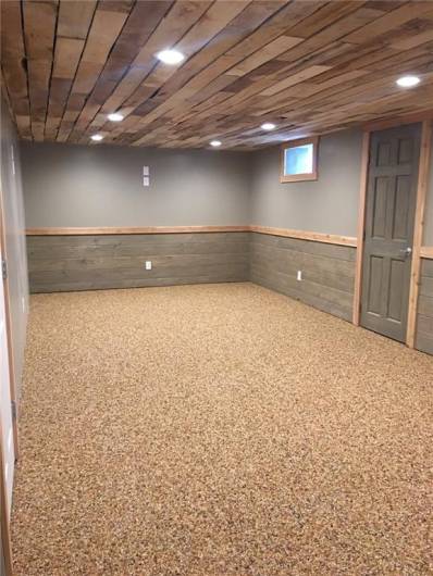 FAMILY/REC ROOM HAS PARTIAL TONGUE N GROOVE WHITE CEDAR WALLS AND NATURE STONE FLOOR