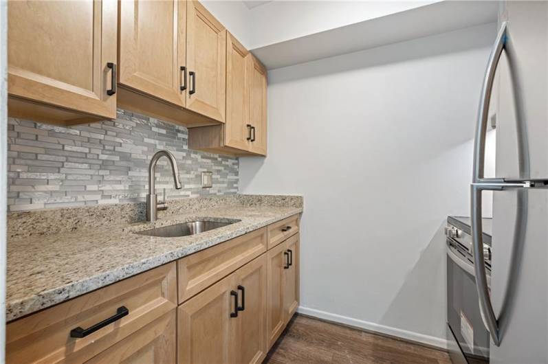 Brand new custom kitchen is elegant and classy.