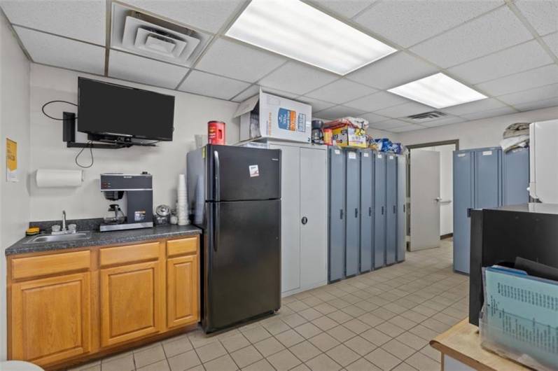 Employee Breakroom with Kitchenette, lockers and washer/dryer.