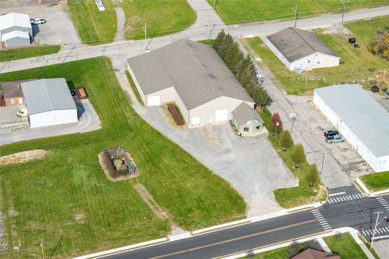 Aerial View of the front showing the gas well and large parking lot.