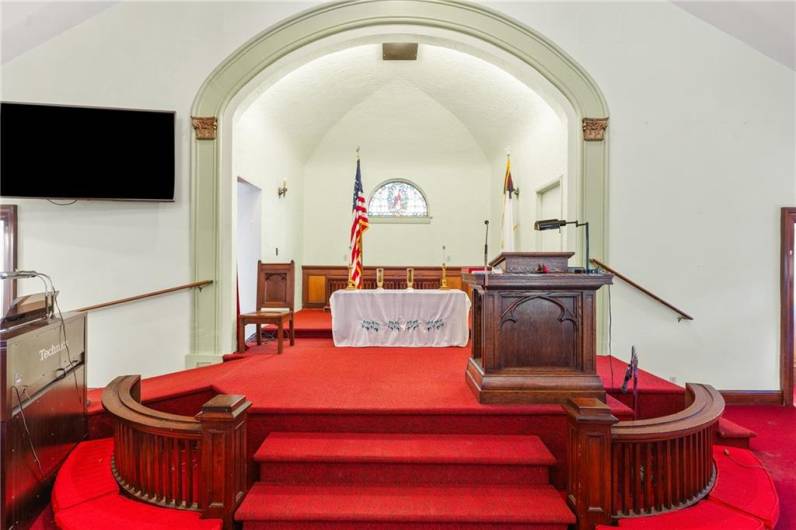 Large alter area with access to a room from right or left.
