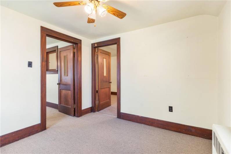 2nd room upstairs with ceiling fan & access to 1st room.