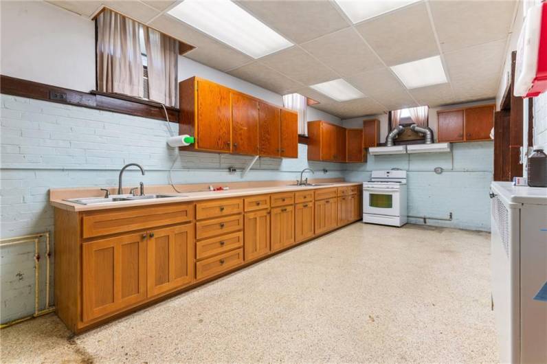 Plenty of cabinets in ktichen & gas stove included w/ room for one more stove.