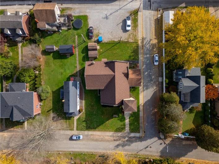 Whole lot showing parking lot & sheds.