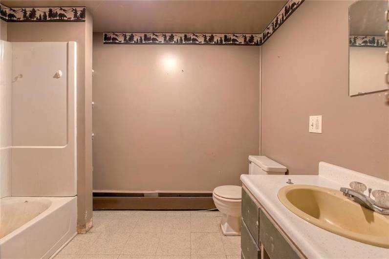 Building 1 - bathroom in the upstairs storage/apartment.