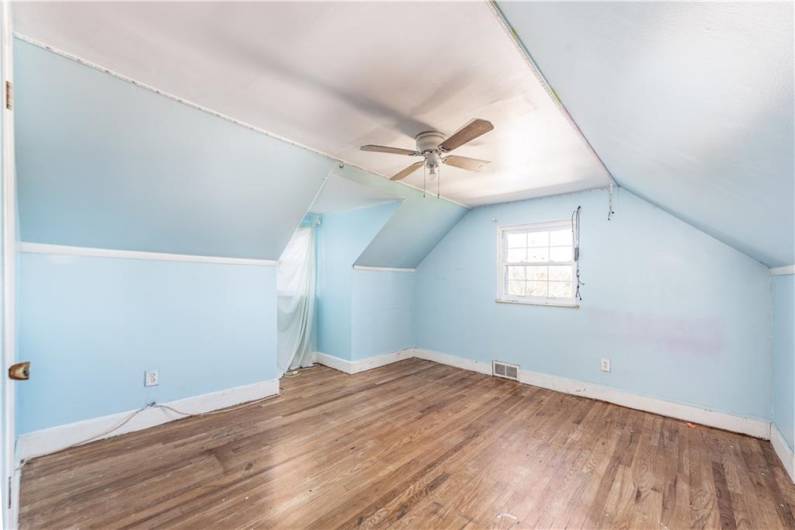 The second of the two upstairs bedrooms.