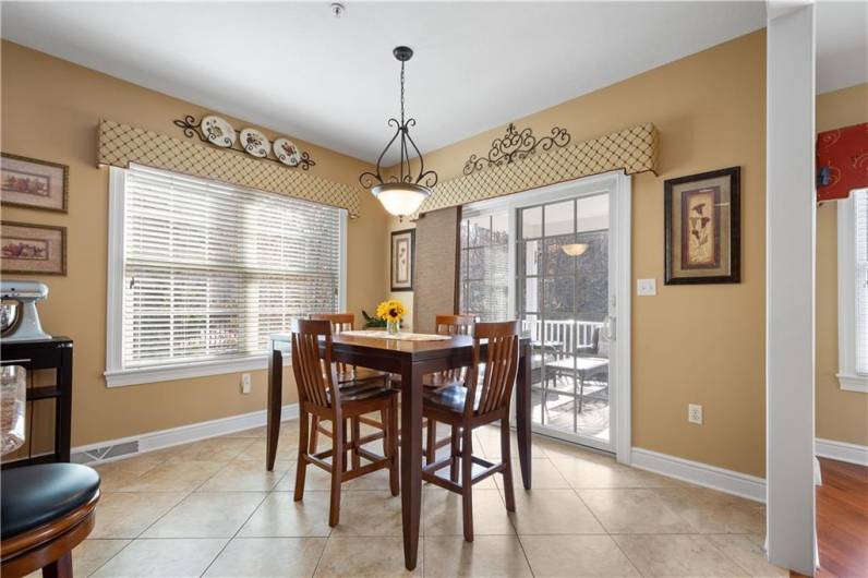 The dinette area is well-lit and conveniently located adjacent to the kitchen.