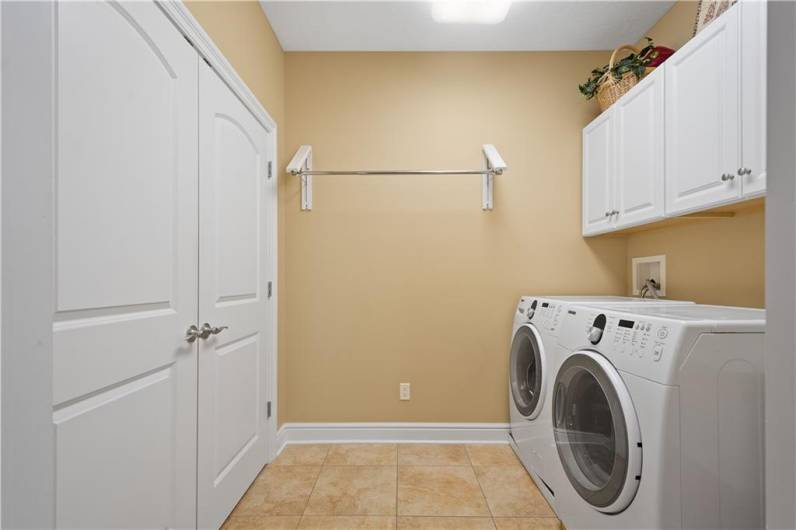 The laundry area is accessible from the main bedroom.