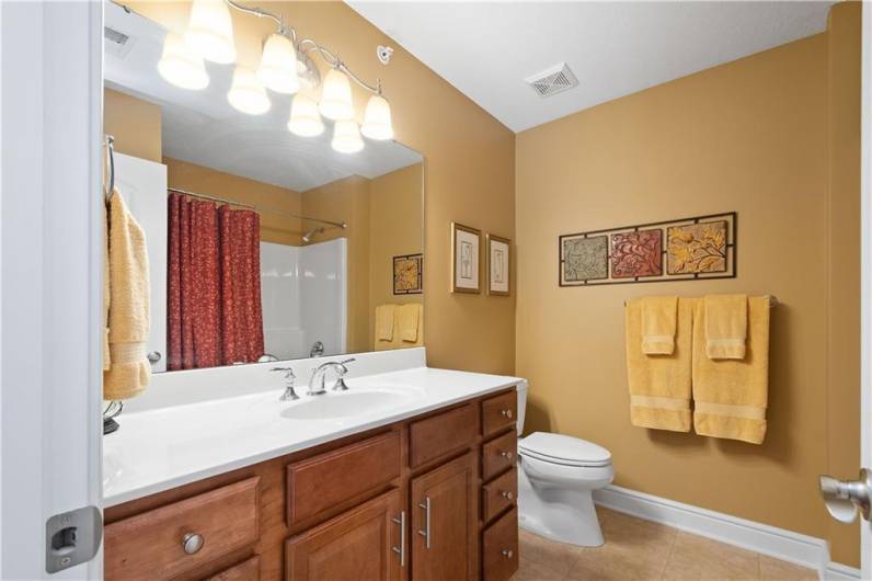 Oversized vanity in this 2nd level shared hall bathroom.