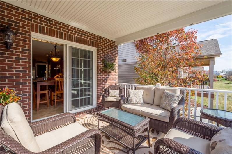 The back porch welcomes an abundance of natural sunlight.