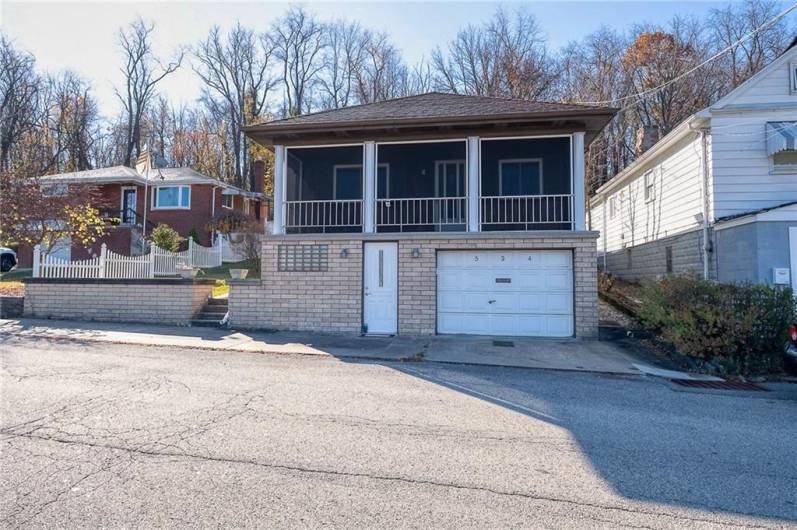 1 car entry garage, but much bigger thant it looks, plus additional off street parking