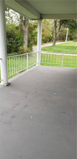 Wow!  Lovely covered Front porch to enjoy your mornings and evenings!