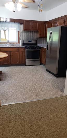 Fully Equipped Kitchen with Gas Stove, small dishwasher & Refrigerator