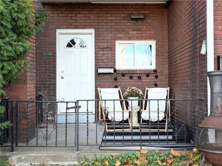 Side porch with the 2nd  entry to the apartment.