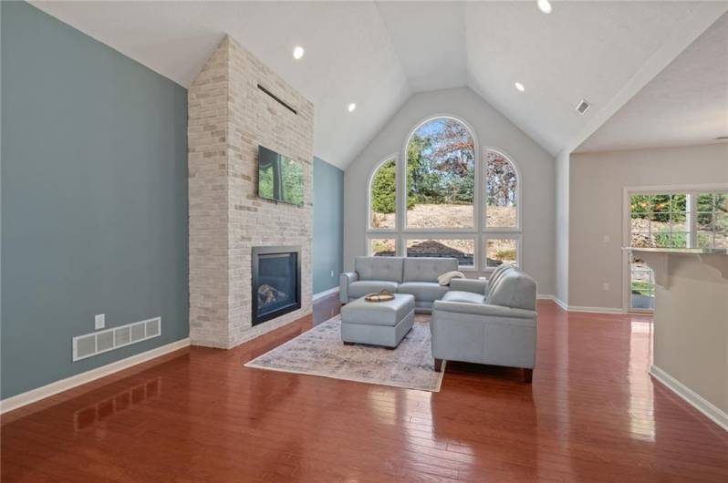 Living Room with Radiant-Heat Gas Fireplace and Hardwood Floors