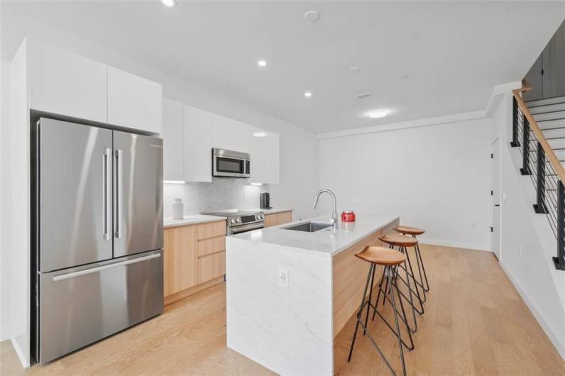 Kitchen with honed Italian carrera marble countertop.