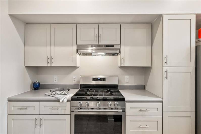 Tasteful new hardwood cabinets were installed in November 2024, with extensive storage in the kitchen that's also supplemented by your walk-in pantry adjacent to the landing.