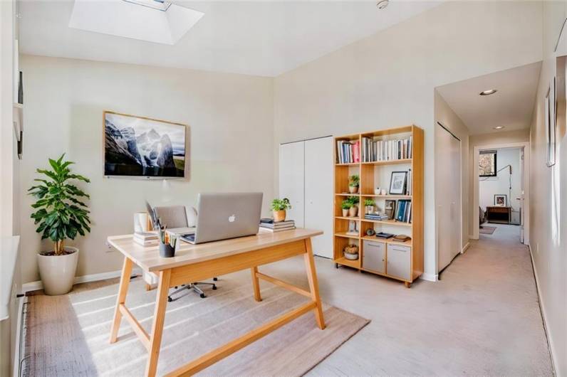 Virtually staged home office with large work table