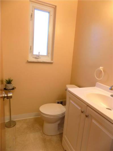 1st floor powder room is located between living room and kitchen.