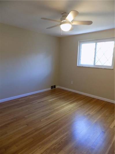 2nd bedroom features gleaming floors and plenty of sunlight