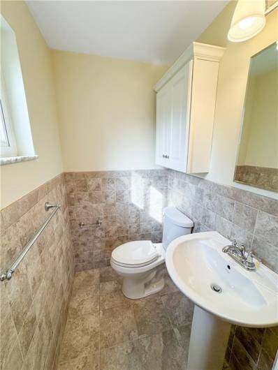 Updated powder room located off the master bedroom.