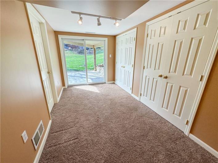 Storage closets and sliding glass door to rear yard.