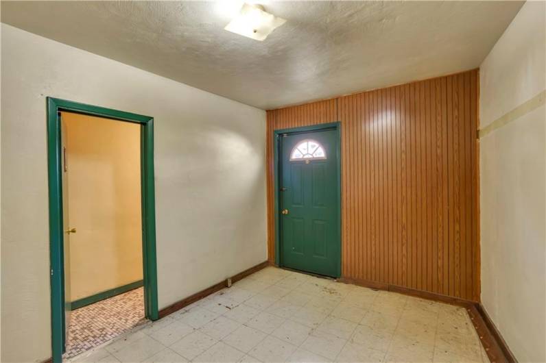 Rear door to Bar, Doorway to Ladies Room. Was used for coat storage, pinball/arcade in past.