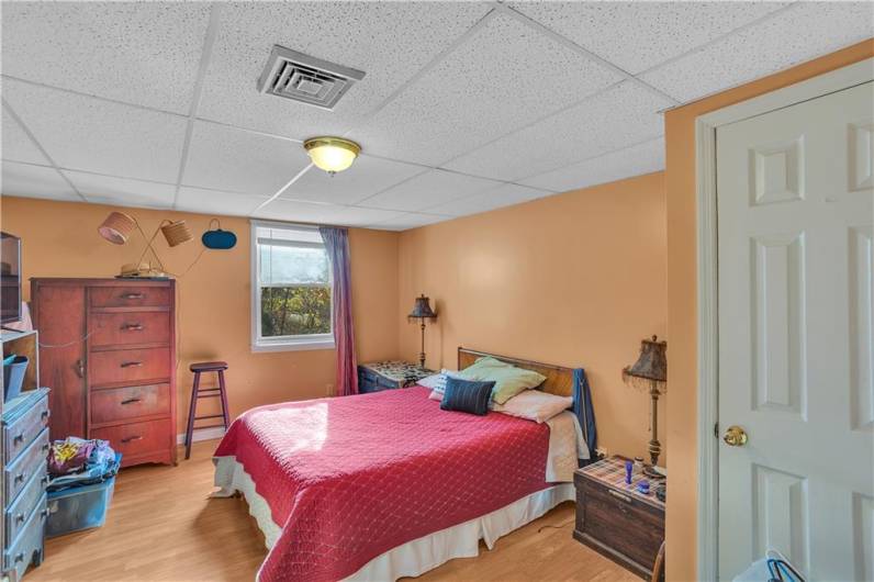 Apartment # , Bedroom #1 with closet, laminate floor and window.