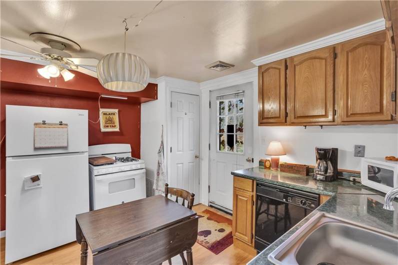 Kitchen, Apartment # .  Door to rear steps/fire escape.