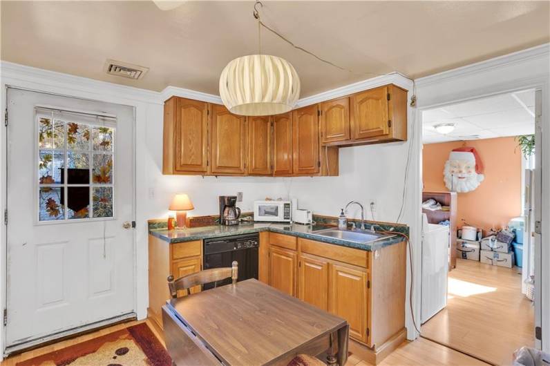 Another view of kitchen, apartment #, doorway to second bedroom.