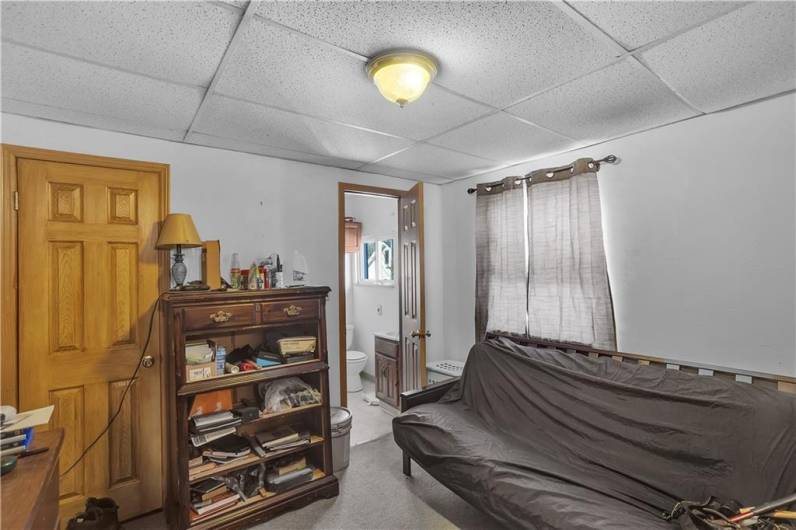 Bedroom, currently used as living room in Apartment # , with adjoining full bath.