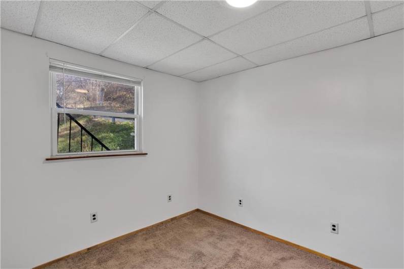 Apartment #1 Living Room with neutral carpet and fresh paint.