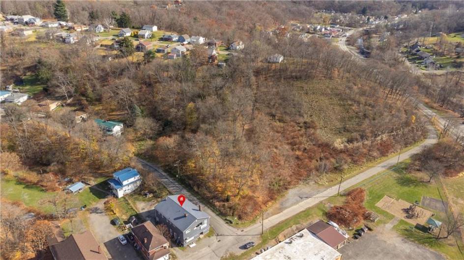 Building at Corner of Broadway and Hill Street. 1.5 Acre Lot on Adjacent Corner, Partially Cleared.