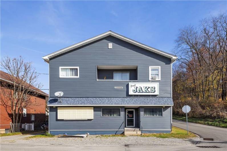 Formerly Just Jaks Bar, with parking in front and behind the building, plus additional 1.5 acre parcel to the right.