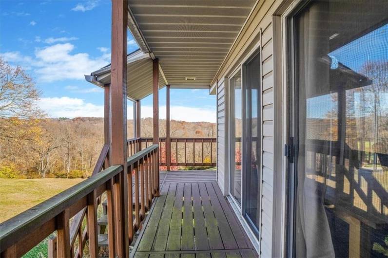 This charming balcony offers a beautiful view of the surrounding landscape, perfect for enjoying quiet mornings or evening relaxation. A great spot to take in the natural scenery with plenty of privacy.