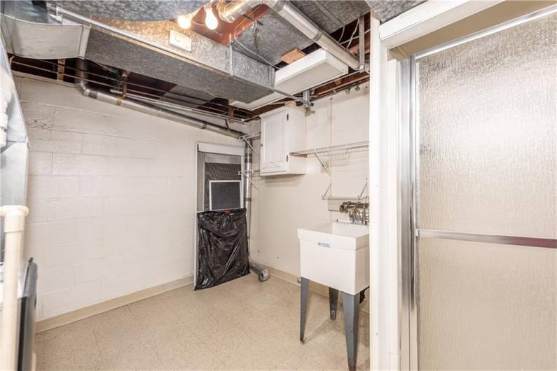 The laundry/utility room is also on the main level.  It is unique in having a stand up shower.  With some creativity, you could create a FULL second bath to this home.