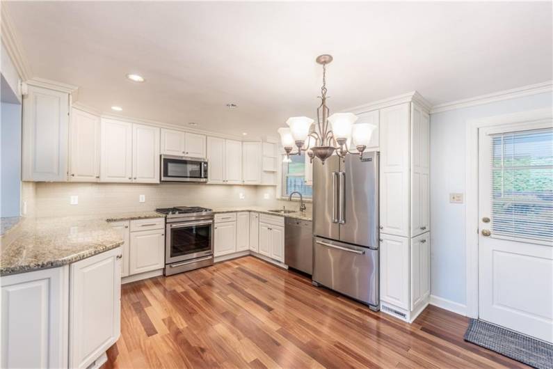 This amazing updated kitchen!!  Beautiful white cabinets, stainless steel appliances.