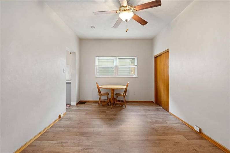 The living and dining area viewed from the bedroom